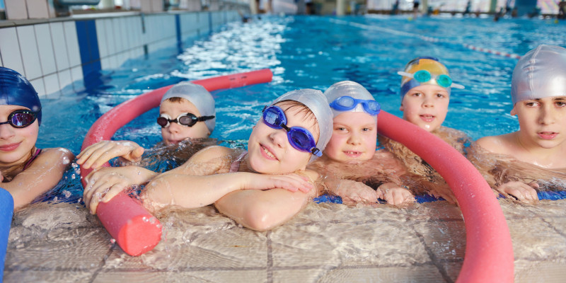 happy children group swimming pool